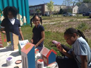 Cooke girls painting butterfly houses